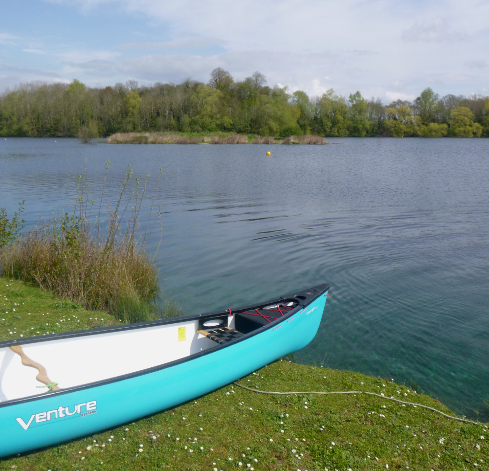 Canoe on side of lake