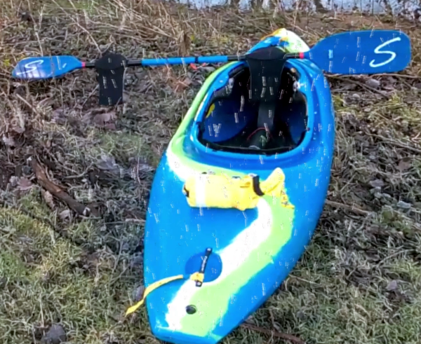 Snow falling on kayak